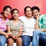 31298628 cheerful indian family with mother and teenage boy girls
